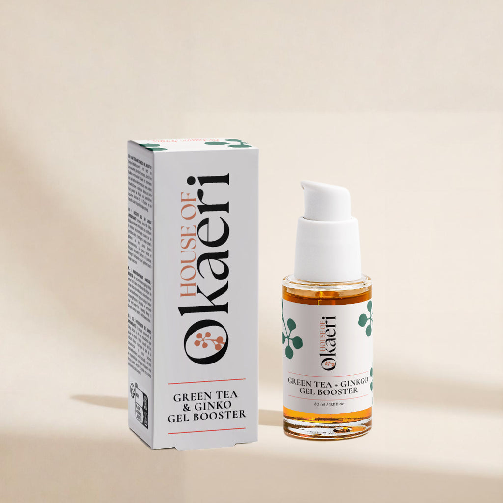 A bottle of House of Okaeri Green Tea & Ginko Gel Booster with its white packaging box, displayed on a warm beige background.