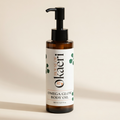 Bottle of House of Okaeri Omega Glow Body Oil on a beige background